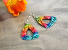 Statement dangle earrings, Rainbow dangle earrings, Colorful earrings, Triangle earrings, Boho earrings, Gift for her 100% HANDMADE AND UNIQUE Looking for a perfect unique gift for a special one or a special treat for yourself? Look no more! Beautiful rainbow dangle earrings made by me with lots of love and attention. Bigger but very easy to wear and combine with different outfits. Great for warm summer days and nights. -------------------------------------------------------- *Material: polymer Colorful Dangle Earrings For Gift, Colorful Earrings As A Gift, Multicolor Hoop Earrings With Ear Wire For Gifts, Multicolor Hoop Earrings With Ear Wire As A Gift, Artsy Multicolor Pierced Earrings, Rainbow Colorful Earrings For Gift, Colorful Dangle Hoop Earrings As Gift, Multicolor Teardrop Hoop Earrings Gift, Artistic Colorful Earrings With Ear Wire