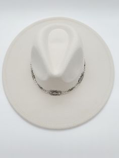 Carry your spirit with you wherever you go when you wear this fedora hat. A playful chain detail and flat brim make it easy to pair with any outfit, while an adjustable strap inside ensures that it fits perfectly. Made of felt, this hat is both practical and stylish! Fedora hat Chain strap detail Flat brim Adjustable inside One size fits most Felt material Crown height 4.5" Brim 3.5" Adjustable Brimmed Fashion Hat, Trendy Wide Brim Fedora For Festivals, Trendy Fedora With Short Brim For Rodeo, Trendy Fedora For Rodeo With Short Brim, Trendy Short Brim Fedora For Rodeo, Trendy Curved Brim Fedora For Festival, Western Silver Hats For Summer, Adjustable Fedora Hat As Fashion Accessory, Silver Summer Hat For Rodeo