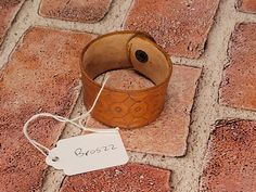 Small hand-tooled unisex saddle-brown leather cuff bracelet. Gorgeous detailing. Perfect for all seasons. Great stocking stuffer or small gift. Hannibal Mo, Leather Cuff Bracelet, Saddle Brown, Hand Tooled Leather, Leather Cuffs Bracelet, Leather Cuffs, Small Hands, Small Gift, Leather Tooling