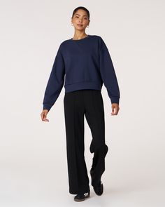 The scuba crewneck sweatshirt is designed with a relaxed fit and dropped shoulders, perfect for any casual activity. It is ideal for dressing down or layering up, whether paired with shorts or joggers. Features subtle embroidered logo and pleat on the back for an elevated piece. Layer this sweatshirt over a blouse and pair it with our pintuck wide leg pant for a professional look. Made from our luxurious scuba fabric, it is has a medium weight coverage and a drapey feel that is cooling and smoot Sporty Boxy Fit Sweatshirt For Fall, Sporty Relaxed Fit Sweatshirt With Ribbed Collar, Sporty Drop Shoulder Sweatshirt With Ribbed Cuffs, Sporty Boxy Fit Crew Sweatshirt, Athleisure Sweats With Relaxed Fit For Elevated Casual, Relaxed Fit Sweats For Elevated Casual Athleisure, Sporty Sweatshirt With Ribbed Collar And Drop Shoulder, Sporty Relaxed Fit Sweats With Drop Shoulder, Relaxed Fit Sweats For Elevated Casual