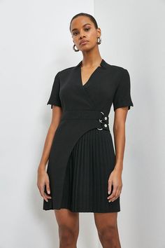 This dress is full of unexpected touches. Proving that it’s all in the details, the piece features an elegant notched collar, buckled detail at the waist (that’ll cleverly draw the eye in) and a cut-out pleated panel that’ll move as beautifully as you. Fitted V-neck Midi Dress With Belt, V-neck Pleated Waist Dress For Work, Black Fitted V-neck Belted Dress, Dressy Mini Dress For Office, Fitted Pleated Belted Summer Dress, Fitted Pleated Belted Dress For Summer, V-neck Belted Dress For Work, Spring Mini Length Belted Dress For Work, Semi-formal V-neck Mini Dress For Office