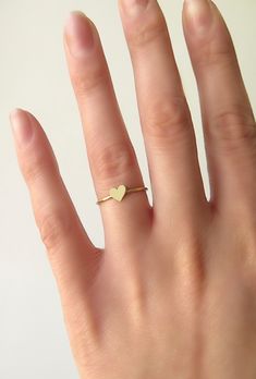 14K 9K Solid Gold Heart Ring, Delicate gold ring, Dainty Rose Gold heart ring, Love Romatnic Jewelry, Minimalist Stacking gold ring, Gift for her, Stackable gold ring, 14K rose gold ring, 9K rose gold ring, 9K gold ring, FREE EXPRESS SHIPPING Dainty 14K or 9K solid gold ring with a tiny heart. Love is always around, hear its whispers and embrace it. <3 More dainty gold rings here: https://www.etsy.com/shop/WhisperGold?ref=seller-platform-mcnav&section_id=23760120 ------------------------- Gold Heart-shaped Stackable Midi Rings, Dainty Stackable Heart Ring Gift, Gold Stackable Heart Midi Rings, Gold Stackable Rings With Heart Charm For Wedding, Delicate Tiny Heart Promise Ring, Dainty Heart Ring For Everyday, Tiny Delicate Heart Promise Ring, Delicate Heart Promise Ring, Dainty Heart Ring For Everyday Wear