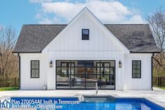 a house with a pool in front of it