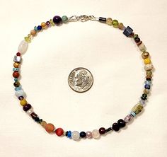 This fantastic Power bracelet or anklet is full of real crystal multicolor gemstones! There are so many varieties and shapes to behold that it's like a shimmering gemstone extravaganza! This bracelet or anklet is made to order, and the gemstones on it and the order in which they are strung will vary. The Gemstones included are my choice, and they may possibly include: Amethyst, Bronzite, Turquoise, Lapis, Freshwater Pearls, Kyanite, Ruby, Apatite, Citrine, Jasper, Agate, Quartz, Peridot, and Gar Multicolor Round Beads Anklets For Gift, Multicolor Round Beads Anklets As Gift, Gift Multicolor Round Beads Anklets, Gift Multicolor Round Bead Anklets, Adjustable Multicolor Multi-stone Crystal Bracelet, Multicolor Multi-stone Adjustable Crystal Bracelet, Power Bracelet, Crystal Rainbow, Colorful Jewelry