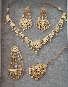 A stunning replica traditional high quality gold jewellery set including a necklace jhumar/passa tikka and chandalier earrings  A stunning Gold style set with perfection to detail looks just like real stuff will compliment and outfit and will stand out from far this set will also make a good addition to your collections but a excellent gift too  Picture do not do full justice Traditional Gold Jewelry, Luxury Hand Set Temple Jewelry Sets, Luxury Yellow Gold Jewelry For Diwali, Punjabi Gold Jewellery Set Traditional, Traditional Gold Necklace, Luxury Motif Jewelry For Puja, Punjabi Jewellery Gold Jewelry Sets, Bollywood Style Gold Jewelry Sets For Puja, Traditional Hallmarked Gold Jewelry Sets