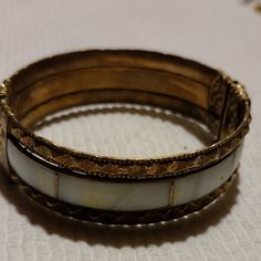 This Is A Extremely Old Circa 1800s Gold And Mother Of Pearl Cuff Style Bracelet In Great Condition. This Was Dated By A Local Antique Dealer And He Said It Is Fairly Easy To Date As They Stopped Using This Type Of Latch In The Late 1800s. This Isn't Just Jewelery It Is History .The Metal Work Is Amazing On This Bracelet And The Mother Of Pearl Is Beautiful . Mother Of Pearl Bracelet, Pearl Cuff, Metal Work, Pearl Bracelet, Womens Jewelry Bracelets, Fashion Bracelets, Antique Gold, Antique Jewelry, Metal Working