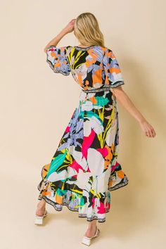 A printed midi dress featuring surplice neckline, fluttered sleeves, elasticised waist with self-sash tie and faux wrap with ruffled hemline Multicolor Fluttered sleeves Self sash tie Elasticized waist Surplice neckline 100% Rayon True to size Multicolor V-neck Floral Dress With Vibrant Print, Patterned V-neck Maxi Dress With Vibrant Print, Multicolor Tropical Print Midi Dress For Day Out, Multicolor Floral Dress With Vibrant Print For Day Out, Casual Floral Dress With Vibrant Print For Brunch, Printed Knee-length Midi Dress For Garden Party, Multicolor Floral V-neck Dress With Vibrant Print, Multicolor Floral Print Vacation Dress, Multicolor Summer Floral Dress With Vibrant Print