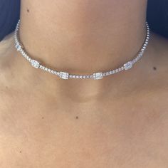 This exquisite choker necklace is crafted from 18Kt white gold and adorned with a total of 2.35 carats of diamonds. The diamonds are of G-H color and VS2 clarity, ensuring a dazzling brilliance and excellent quality. The necklace features both baguette and round cut diamonds, creating a beautiful and sophisticated design that elegantly complements any outfit. Luxury Diamond White Rectangular Necklace, Fine Jewelry White Gold Diamond Choker Necklace, White Gold Diamond Choker Necklace, White Gold Cubic Zirconia Choker, Diamond Choker With Diamond Accents, Diamond Choker Necklace With Diamond Accents, White Gold Diamond Choker For Wedding, Formal Diamond Tennis Necklace Choker, Formal Diamond Tennis Choker Necklace