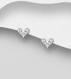 925 Sterling Silver Heart Push-Back Earrings, Decorated with CZ Simulated Diamonds Width: 9/32 inches Height: 1/4 inches Silver Heart Charm Earrings For Anniversary, Silver Earrings With Heart Charm For Anniversary, Heart-shaped Sterling Silver Earrings With Diamond Accents, White Sterling Silver Heart Earrings For Anniversary, White Gold Heart-shaped Sterling Silver Diamond Earrings, Sterling Silver Heart Charm Earrings For Anniversary, Silver Double Heart Earrings With Diamond Accents, Silver Heart Earrings With Diamond Accents For Anniversary, Sterling Silver Heart Earrings With White Gold Heart Charm