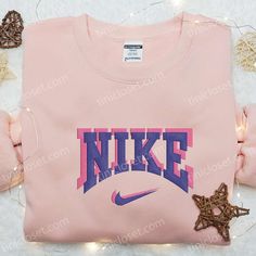 Pink Purple Nike Logo Embroidered Shirt, Nike Inspired Embroidered Hoodie, Best Gifts For Family Welcome to Tinicloset, where we’ve mastered the art of blending style, passion, and individuality into every stitch, and where fashion enthusiasts who adore Nike and the captivating hues of pink and purple find their sartorial haven. We specialize in crafting custom embroidered shirts, sweatshirts, T-shirts, and hoodies, each meticulously designed to elevate your wardrobe and make a statement. Nike Inspired, Embroidered Shirts, Purple Nikes, Shirt Nike, Embroidered Hoodie, Great Love, Pink And Purple, Embroidered Shirt, Nike Logo