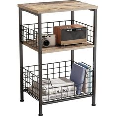 a metal shelf with books and a microwave on top, next to a stack of books