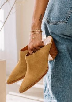 Hop on the TREND TRAIN with these super cute Pointed Toe Suede Mules. The color is chef's kiss for fall. Comfortable enough for all day wear, these new mules from Matisse will become your go to this season. The heel is not too high and the style is perfect. If you live in the south, this will be a good shoe for most of the winter. Suede upper Manmade outsole 2.5 in/6.35 cm heel Textile lining Padded insole Leather stacked heel Imported Spring Low Heel Mules With Reinforced Heel, Chic Spring Clogs With 4-inch Heel, Casual Suede Mules With Block Heel, Casual Mules With Low Heel And Medium Width, Casual Mules With Medium Width And Low Heel, Chic Fall Mules For Workwear, Casual Medium Width Low Heel Mules, Chic Fall Workwear Mules, Trendy Spring Mules With Wooden Heel