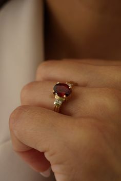 Featuring a beautiful oval center stone made of garnet set in a grooved-like setting. Please allow 1-2 weeks for delivery. Garnet Engagement Ring Gold, Chunky Engagement Rings, Engagement Ring Gold, Garnet Engagement Ring, Pre Black Friday, Hessonite Garnet, Garnet Jewelry, Garnet Ring, New Bands