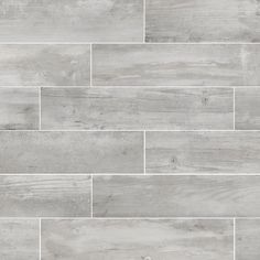 grey wood flooring with white tile in the middle and gray tiles on each side