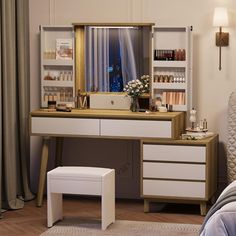 a bedroom with a dressing table, stool and shelves on the wall next to it