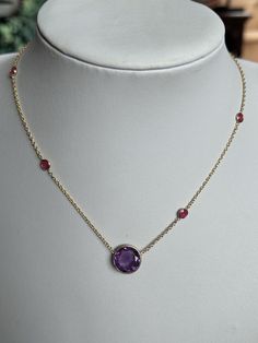 A brand new 18k Gold Vermeil (plated)  necklace. Natural amethyst  stone and smaller ruby stones.  What is Vermeil? Whilst similar to gold plating gold vermeil is distinctly different to it. Gold vermeil originated in the 19th century where gold was applied to sterling silver. Although still using the plating technique gold vermeil requires a thicker layer. At least 2.5 microns of gold.  Stamped 925 silver as this is the base metal with gold vermeil, this was bought as a collection of jewellery with some pieces signed and others not. See my other listings.  Adjustable length (approx) : 40cm/45cm/48cm 3 available Box not included  WELCOME to antiquesandchic, we are a family run business offering good antiques, jewellery and collectables.  We never know what treasures we are going to list ne Hallmarked Amethyst Round Pendant Necklace, Classic Hallmarked Amethyst Necklace, Elegant Purple Round Birthstone Necklace, Hallmarked Amethyst Round Necklace, Amethyst Necklace With Bezel Setting As Gift, Gift Amethyst Necklace With Bezel Setting, Formal Amethyst Round Pendant Necklace, Purple 14k Gold Necklace For Anniversary, Elegant Gold Amethyst Birthstone Necklace