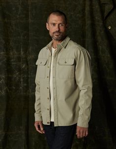 Crisp and structured. This shirt jacket is constructed from 100% Cotton canvas. It achieves an effortlessly rugged look with triple needle stitching for durability and a relaxed fit, great for layering. The jacket also includes two chest pockets with flaps, a shirt collar, a front button placket, a back yoke with a box pleat, elbow panels, sleeve cuffs with plackets, and a flattering shirttail hem. Khaki Outdoor Shirt With Button Closure, Overshirt Women, Outdoor Button-up Shacket With Flap Pockets, Military Cotton Collared Utility Jacket, Workwear Button-up Camp Shirt With Welt Pockets, Fall Color Trend, Outdoor Button-up Camp Shirt With Pockets, Workwear Jacket, Rugged Look