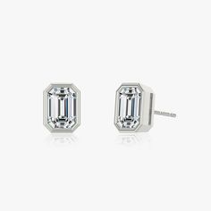 The Bezel Solitaire Studs combine vintage-inspired detail and modern appeal together for a look that’s timelessly elegant. Classic White Gold Earrings With Timeless Design, Classic White Gold Earrings, Classic White Gold Baguette-cut Earrings, Classic Sterling Silver Earrings With Timeless Design, Formal Silver Diamond Earrings, Emerald Cut, Silver Emerald Cut Diamond Earrings For Formal Occasions, Formal Silver Emerald Cut Diamond Earrings, Elegant Octagon Prong Set Diamond Earrings, Elegant Octagon Diamond Earrings With Prong Setting