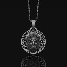 Silver Zeus Men's Oxidized Finish Mythological Style Round Jewelry Gift, Ancient Style Engraved Jewelry Gift, Etched Stainless Steel Silver Jewelry, Spiritual White Gold Jewelry With Box Chain, Symbolic Sterling Silver Coin Pendant Jewelry, Silver Necklace With Round Pendant In Vintage Style, Engraved Stainless Steel Medallion Jewelry, Symbolic White Gold Jewelry With Box Chain, Spiritual Stainless Steel Jewelry With Oxidized Finish