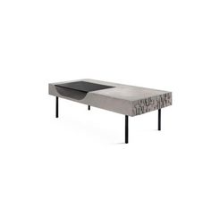 the table is made out of concrete and has black metal legs, with an interesting design on