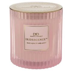 a pink candle that is sitting in front of a white background with the words indidescence on it