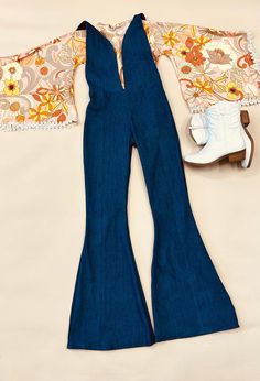 - Express Your Unique Vibe -  Get ready to groove in style with our Kids Denim Retro Style Jumpsuit! Made from soft and durable denim fabric, this jumpsuit is the perfect combination of comfort and style. Featuring a vintage print exaggerated bell sleeve top with trim detailing and bell bottoms, this jumpsuit is available in light and dark wash denim options. Whether your child prefers the classic blue of light wash denim or the edgy look of dark wash denim, we've got you covered! Our Kids Denim Retro Style Jumpsuit is available in a range of sizes to fit children of all ages and body types. The playful design and comfortable fit make it a must-have for any fashion-conscious child who loves to have fun and express their individuality. So, whether your child is headed to a party or just pla Retro Dark Wash Denim Jumpsuit, Fitted Overall Pants For Fall, Fitted Overalls For Fall, Fitted Fall Overalls Pants, Denim Blue Retro Overalls, Retro Denim Blue Overalls, Fitted Retro Medium Wash Pants, Fitted Full-length Medium Wash Overalls, Retro Cotton Fitted Jumpsuits And Rompers