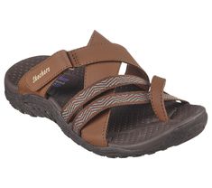 Explore the great outdoors in boundless comfort with Skechers Reggae - Sunday Stroll. This trail slide sandal features a synthetic and woven fabric upper with a cushioned comfort footbed. Adjustable Cushioned Slides For Outdoor Activities, Comfortable Brown Slide Sport Sandals, Comfortable Brown Sport Slide Sandals, Brown Synthetic Slide Sport Sandals, Comfortable Open Toe Slides For Outdoor Activities, Textured Open Toe Slides For Outdoor Activities, Open Toe Slides With Textured Footbed For Outdoor, Brown Slides With Arch Support For Outdoor, Synthetic Slide Sandals For Outdoor Activities