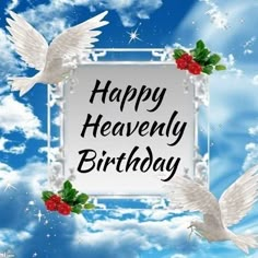 happy heavenly birthday with white doves and holly berries on blue sky background, surrounded by clouds