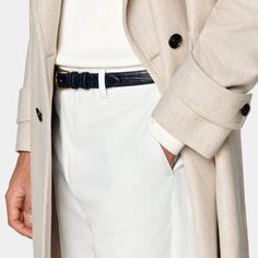 Mid-thigh length overcoat in sand, featuring wide peak lapels and natural shoulders. Double-breasted closure, patch pockets, and inside pockets for functionality. Single vent, lined, with martingale belt for style. Luxury Cream Outerwear With Double Button Closure, Formal Gabardine Wool Coat With Notch Lapel, Elegant Semi-formal Outerwear With Belt Loops, Elegant Outerwear With Suit Collar And Belt Loops, Elegant Outerwear With Belt Loops And Suit Collar, Classic Business Wool Coat In Gabardine, Business Single Breasted Gabardine Wool Coat, Business Gabardine Wool Coat Single Breasted, Single-breasted Gabardine Wool Coat For Business