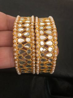 It's time you level up your jewelry box! Add in some bling to with our royal handmade kundan bangles! Style with love and care! We put in so much effort in what we do,because we do it for YOU❤️ Made to order and shipping time 4-6 weeks Can be make as a pair or single too. Each bangle price : $20 Diwali Gold Jewelry With Stone Work, Gold Kundan Necklace With Stone Work As Gift, Gold Chandbali Jewelry For Navratri, Bangle Bracelets As Diwali Gifts, Gold Toe Ring Jewelry For Diwali, Diwali Gift Toe Ring Jewelry, Gold Round Chandbalis With Stone Work, Gold Stone Work Round Chandbalis, Festive Kundan Jewelry Gift