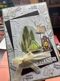 a hand holding up a card with some things on it and the words happy trails