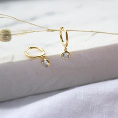 CZ tiny gold hoop earrings, solid gold earrings,  huggie earrings, small hoop earrings with charm, cz drop dangle earrings, wedding earrings A beautiful dainty  CZ hoops earrings simple and cute, perfect for everyday wear.  D E T A I L S: * Hoop: 16mm  * CZ: 7mm M A T E R I A L S: * 100% Sterling Silver 925 or 18K Gold Filled * All sourced from USA -----------------------♡-------------------- H O W T O O R D E R 1.) Choose the Option (Color) in the drop down menu 2.) Choose the quantity in the d Dainty Huggie Earrings For Anniversary, Dainty Tarnish Resistant Huggie Earrings For Wedding, Dainty Tarnish-resistant Huggie Earrings For Wedding, Dainty Yellow Gold Huggie Earrings, Tiny Hoop Huggie Earrings For Anniversary, Dainty Huggie Earrings For Gift, Dainty Huggie Earrings For Wedding, Dainty Tarnish Resistant Drop Huggie Earrings, Dainty Tarnish-resistant Drop Huggie Earrings