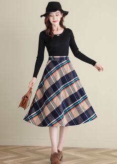 "★★ FEATURES * Wool skirt * Polyester lining * Two side seam pockets * Right zipper closure * back elastic band * Plus size full skirt * A Line Skirt * Perfect for Winter, autumn * Dry clean ★★ The model is 170 cm (5′ 7″) tall with a 80 cm (31.5\") bust, 66 cm (26\") waist. She is wearing the wool plaid skirt in size XS. ★★ Please select custom order according to the follow situation Your height is not between 155 cm- 172 cm Your weight is over 75 kg Request the length ★★ Get your size in Size C Retro A-line Winter Skirt, Beige Flared Skirt For Winter, Winter Beige Flared Skirt, Vintage A-line Skirt For Fall, Retro Winter Skirt, Retro A-line Skirt For Winter, Retro Wool Skirt For Fall, Vintage Flared Skirt For Winter, Vintage Flared Winter Skirt