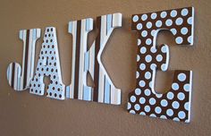 the letters are made out of wood and decorated with polka dots