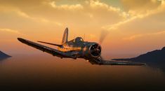 an old airplane flying over the ocean at sunset or dawn with mountains in the background