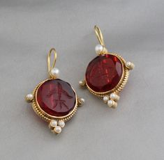 Description Gemstone - Red Glass Material - Brass Gemstone Size - 18 mm Earring Height Including Hoop - 4 cm Earring Width - 2 cm Finish - Smooth and high polished with Little Oxide Antique Look. Note -The earrings are made to order, production day is about 3-5 working days. The one you receive may be slight different from the one in the picture due to handmade nature, but it will be almost same as in the above picture.These pieces are handcrafted from start to finish and have an imperfect handmade look.These earrings are the perfect addition to your collection. Our rings are meant to be classic enough for everyday wear or to give as a bridesmaid gift. You will receive the same piece as in the picture or identical. Since all gemstones are different from each other, I cannot guarantee that Jewlery Rings, Dainty Gold Earrings, Silver Jewlery, Printed Dress Shirts, Earrings Vintage, Red Glass, Glass Material, Bridesmaid Gift, Vintage Earrings