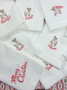 several white napkins with red lettering on them