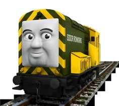 a cartoon train with a smiling face on it's front and side, sitting on the tracks