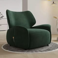 a green chair sitting on top of a rug