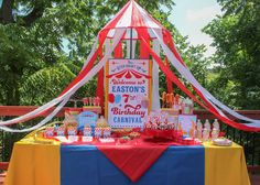 an outdoor birthday party setup with decorations and table cloths on the outside deck area