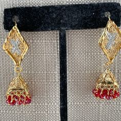 Women Earrings Gold Tone Fashion Red Beads Jhumka Style Jewelry New Unbranded Fashion Jewelry Color; Gold, Red Length: Almost 2 Inches Drop Brand New. Never Used. Festive Dangling Beads Earrings For Celebration, Festive Celebration Earrings With Dangling Beads, Red Temple Jewelry Drop Earrings, Red Temple Jewelry Drop Danglers, Red Temple Jewelry Style Danglers, Traditional Beaded Earrings With Dangling Beads For Party, Beaded Latkans Earrings For Party And Festivals, Festive Dangling Beads Beaded Earrings For Celebrations, Gold Bohemian Beaded Earrings For Festive Occasions