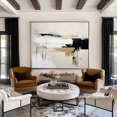 a living room filled with furniture and a painting on the wall