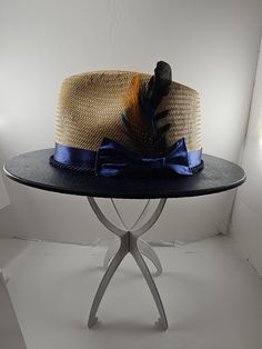 FUR FEATHER Wide Brim FEDORA Hat, Cream or Natural Royal Blue Themed Oak Wooden Brim Hat for Fashion I'm thrilled to introduce you to my latest creation, the Wide Brim Fedora Hat, designed to elevate your fashion game and make a striking statement. This luxurious piece features a royal blue-themed oak wooden brim that adds a sophisticated touch to any look. Whether you choose Cream or Natural, this hat will seamlessly complement your outfit, whether you're dressing up for a special occasion or a Gatsby Style Wide Brim Adjustable Hats, Gatsby Style Adjustable Top Hat For Kentucky Derby, Blue Feathered Summer Costume Hats And Headpieces, Feathered Hat Bands For Beach Events In Summer, Blue Adjustable Hat With Feather Trim, Adjustable Blue Hat With Feather Trim, Adjustable Blue Mini Hats With Feathers, Blue Feathered Costume Hat, Adjustable Blue Fedora Straw Hat