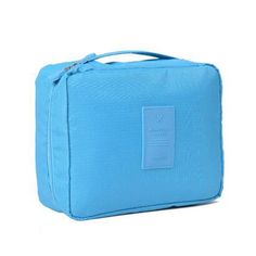 a small blue bag with a tag on it's front and side pocket in the middle