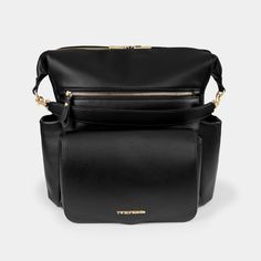 a black leather bag with gold hardwares on the front and shoulder strap, sitting in front of a white background