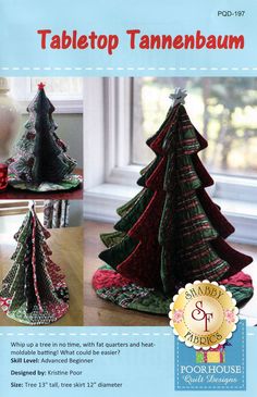 a crocheted christmas tree sitting on top of a table next to a window