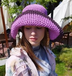 Buy a trendy raffia hat for the beach. An original and exclusive straw raffia hat that is indispensable in hot summer. Purple  panama women hat crocheted by hand. Material- 100% straw raffia. Very lightweight and absolutely not felt on the head, you can wear it even all day long. The size is universal for an adult, as a head circumference of 54- 57 cm (21- 22.5 in) would be ideal. This hat is crocheted so that it can be folded comfortably without losing its shape for further use.Has a beautiful pattern on the top.   The hat can be washed freely when it gets dirty. Product color in photo images may differ from the original due to different monitor and camera settings. And also at the yarn manufacturer, the shades of color differ in different batches of goods. There are handbags in the store Bohemian Sun Hat In Toquilla Straw With Upf 50+, Bohemian Hats For Beach Season, One Size, Whimsical Hand-knitted Crochet Hat For Beach, Ruffled Crochet Beach Hat, One Size Fits Most, Pink Crochet Sun Hat, One Size Fits Most, Raffia Hat, Boho Hat, Beach Hat, Brim Hat