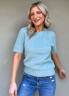 Short sleeve crew neck sweater in a classic blue hue, designed for effortless style and unmatched comfort. This versatile piece is perfect for layering or wearing on its own, making it a must-have addition to your wardrobe. Its lightweight fabric ensures breathability while keeping you cozy. Olivia is wearing xsmall Color: Slate Blue Material: 58% NYLON, 27% VISCOSE, 15% POLYESTER Hand wash cold, Reshape flat dry Crew neck Fabric has good stretch Imported Body length from HPS: 22", Sleeve length Casual Snug Sweater For Layering, Everyday Snug Crew Neck Sweater, Blue Crew Neck Sweater With Ribbed Neckline, Fall Short Sleeve Loungewear Sweater, Fall Short Sleeve Sweater For Loungewear, Fall Loungewear Sweater With Short Sleeves, Fall Loungewear Short Sleeve Sweater, Snug Crew Neck Top For Fall, Soft Textured Crew Neck Sweater For Layering