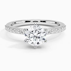 a white gold engagement ring with diamonds on the side