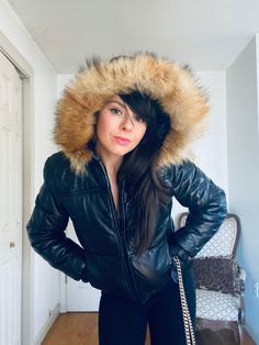 Absolutely the BEST  vintage leather bomber in existence. This 1970s Fox fur trim jacket is in pristine condition. My mother kept it in her closet for the past 40 + years , and it's absolutely perfect.  The black leather is buttery soft and without imperfections or signs of wear. The Fox fur is fluffy and lush . Makes me wonder if my mom ever wore it !!  It's a perfectly petite size Sm / XS .  Gorgeous custom / tailor look     My pops told me he remembers buying it for her before they bought a house together in 1977 . He also remembered paying $650 for it , which at the time was a pretty solid chunk of change.  Well needless to say , It turned out to be a great buy , because they tied the knot and here I am  This jacket for the BIG WIN !! If you have any more questions about this killer bo Winter Leather Jacket With Detachable Hood, Faux Fur Leather Jacket For Cold Weather, Fitted Hooded Leather Jacket For Cold Weather, Hooded Leather Jacket With Faux Fur Lining For Winter, Winter Hooded Leather Jacket With Faux Fur Lining, Winter Leather Jacket With Faux Fur Lining And Hood, Hooded Leather Jacket With Faux Fur Trim For Fall, Fitted Faux Fur Hooded Coat, Cold Weather Faux Fur Leather Jacket